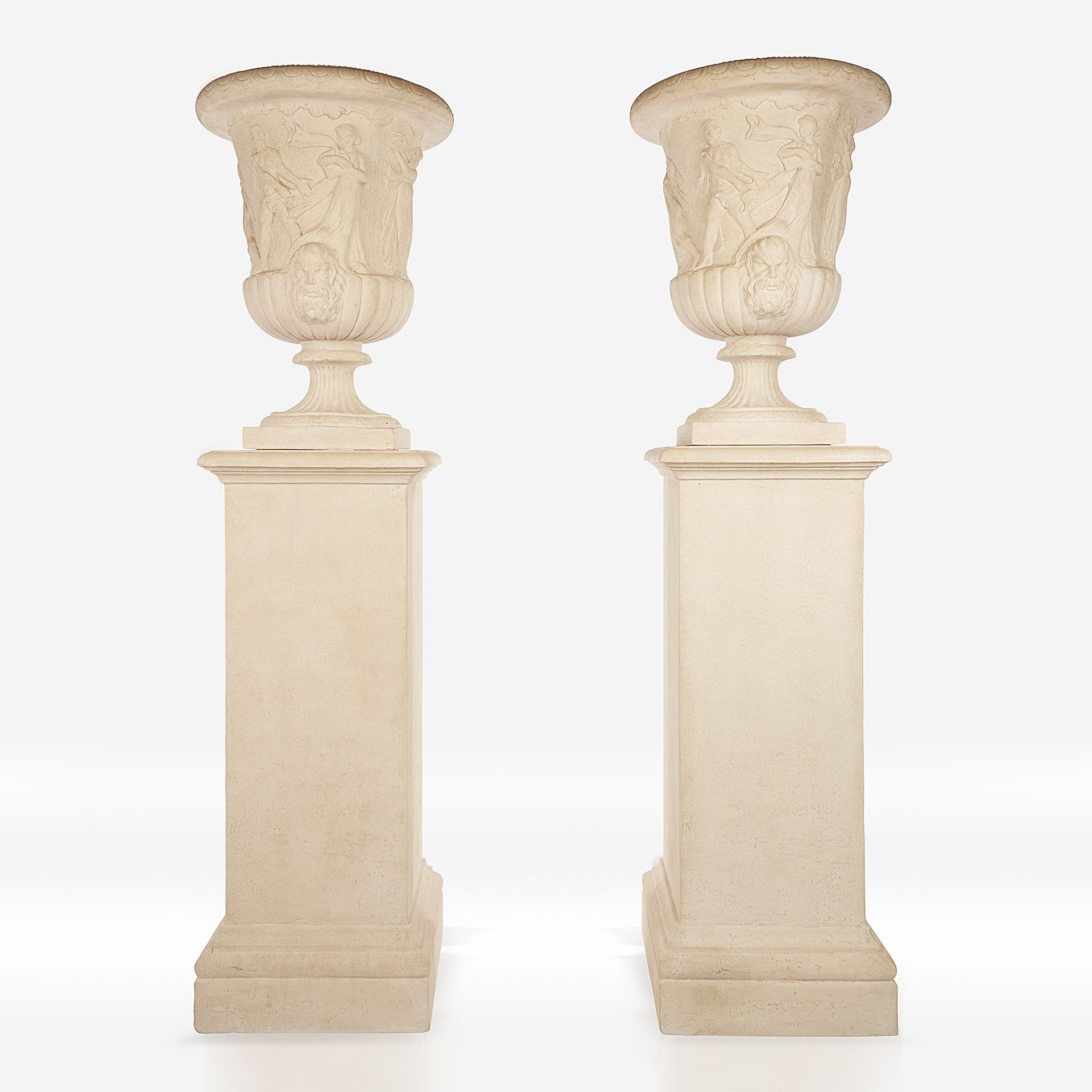 A pair of cast stone campana urns on pedestals, 20th century