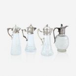 Four silver-mounted cut-glass claret jugs, 19th century