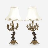 A pair of Louis XV style gilt and patinated bronze figural six-light candelabra, Early to mid 20th c