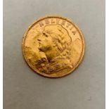 Une pièce 20 Francs or suisse 1935. Poids 6,5 grammes. TBE.