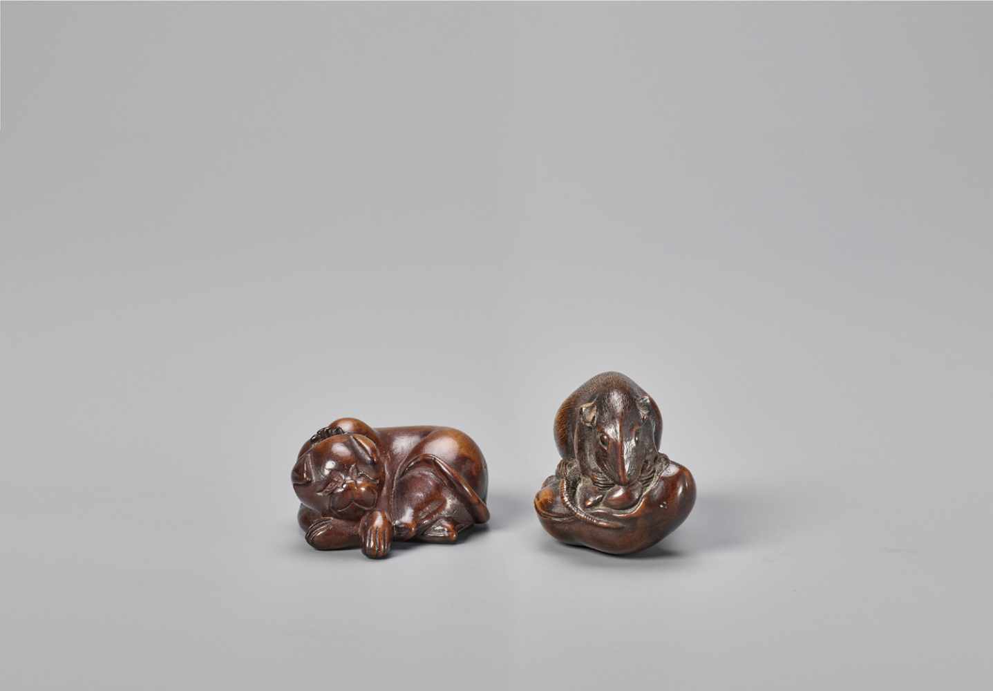 TWO WOOD NETSUKE OF A CAT AND A RAT
