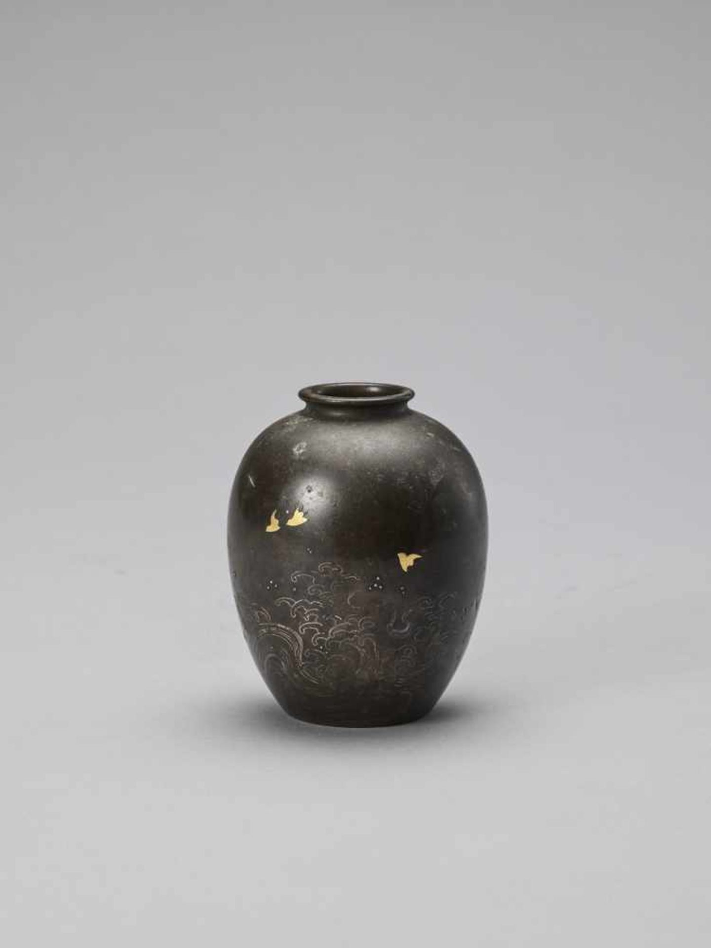 A SMALL SILVER INLAID BRONZE VASE
