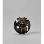 SHUNGYOKU: AN UNUSUAL INLAID EBONY WOOD INLAID NETSUKE WITH TEA MERCHANT