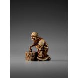 HOGYOKU: A FINE IVORY NETSUKE OF A TANUKI PRIEST