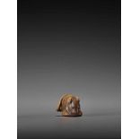 A WOOD NETSUKE OF A RAT WITH CHESTNUT