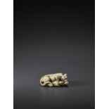 TOMOTADA: AN IVORY NETSUKE OF A RECUMBENT COW AND CALF