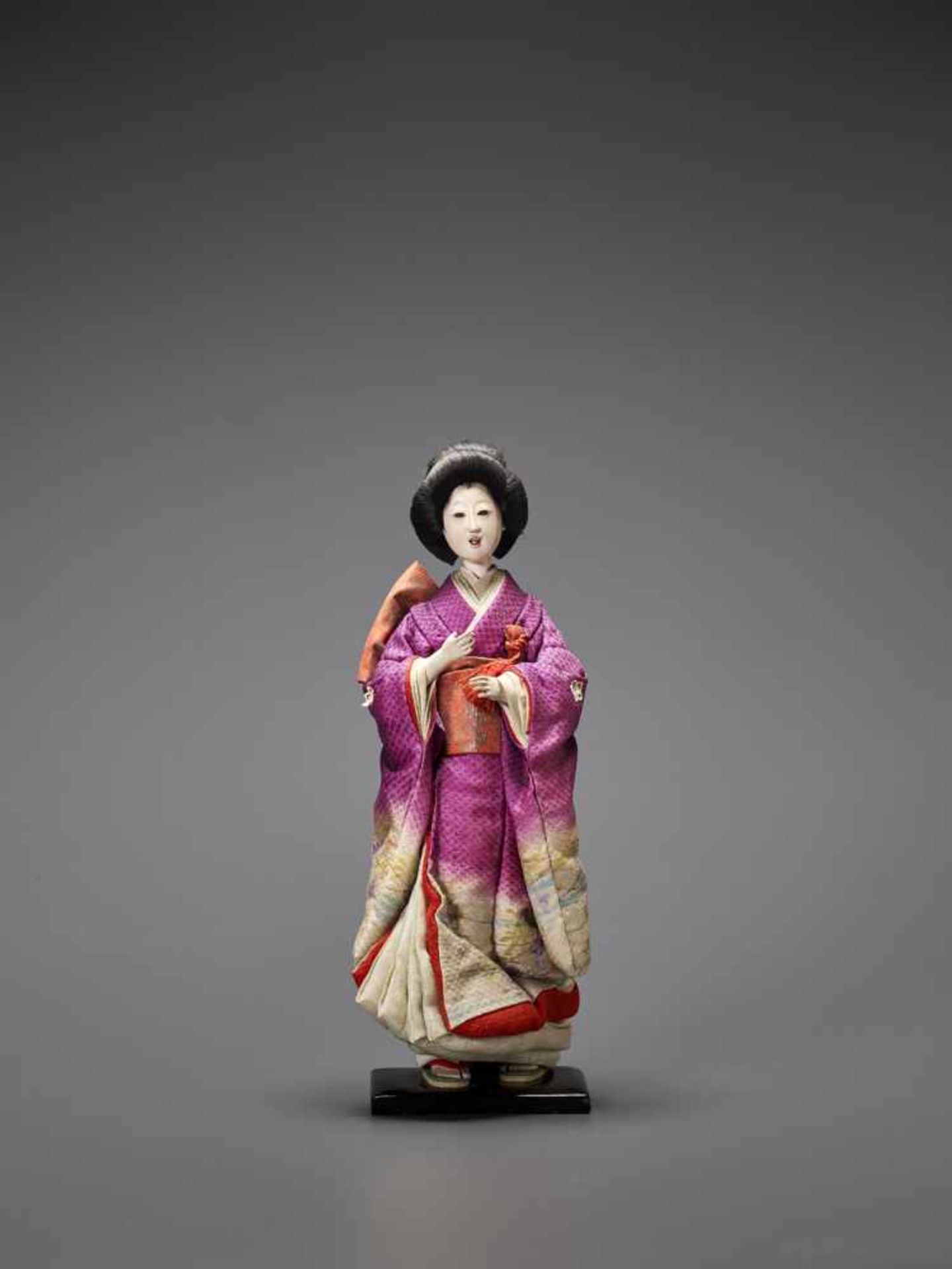 A FABRIC DOLL OF A GEISHA