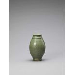 A CARVED LONGQUAN CELADON ‘LOTUS’ JAR, YUAN TO EARLY MING <br