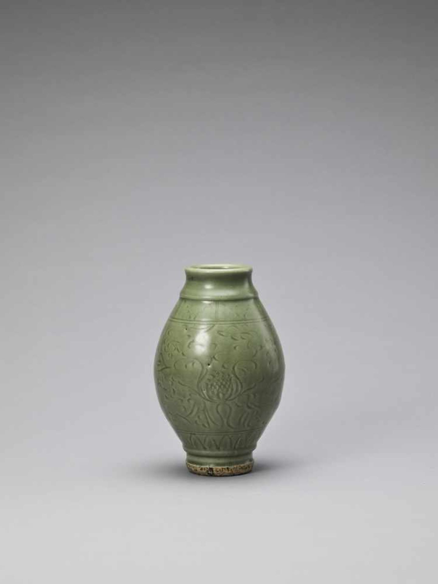 A CARVED LONGQUAN CELADON ‘LOTUS’ JAR, YUAN TO EARLY MING <br