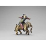 A GLAZED TERRACOTTA FIGURE OF A DIGNITARY RIDING AN ELEPHANT, MID-QING