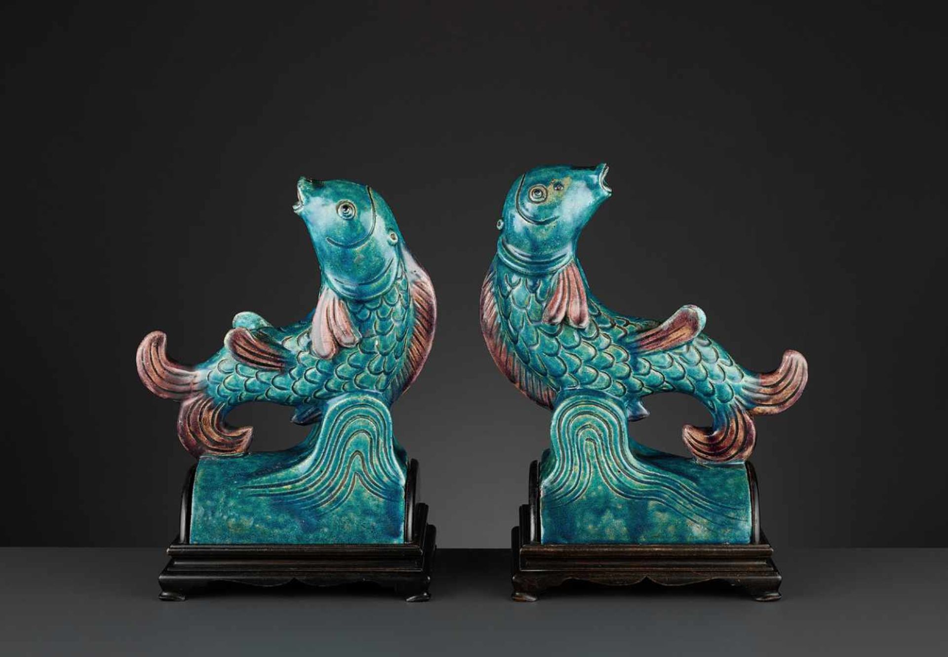TWO AUBERGINE AND TURQUOISE GLAZED ‘FISH’ ROOF TILES, MING <br