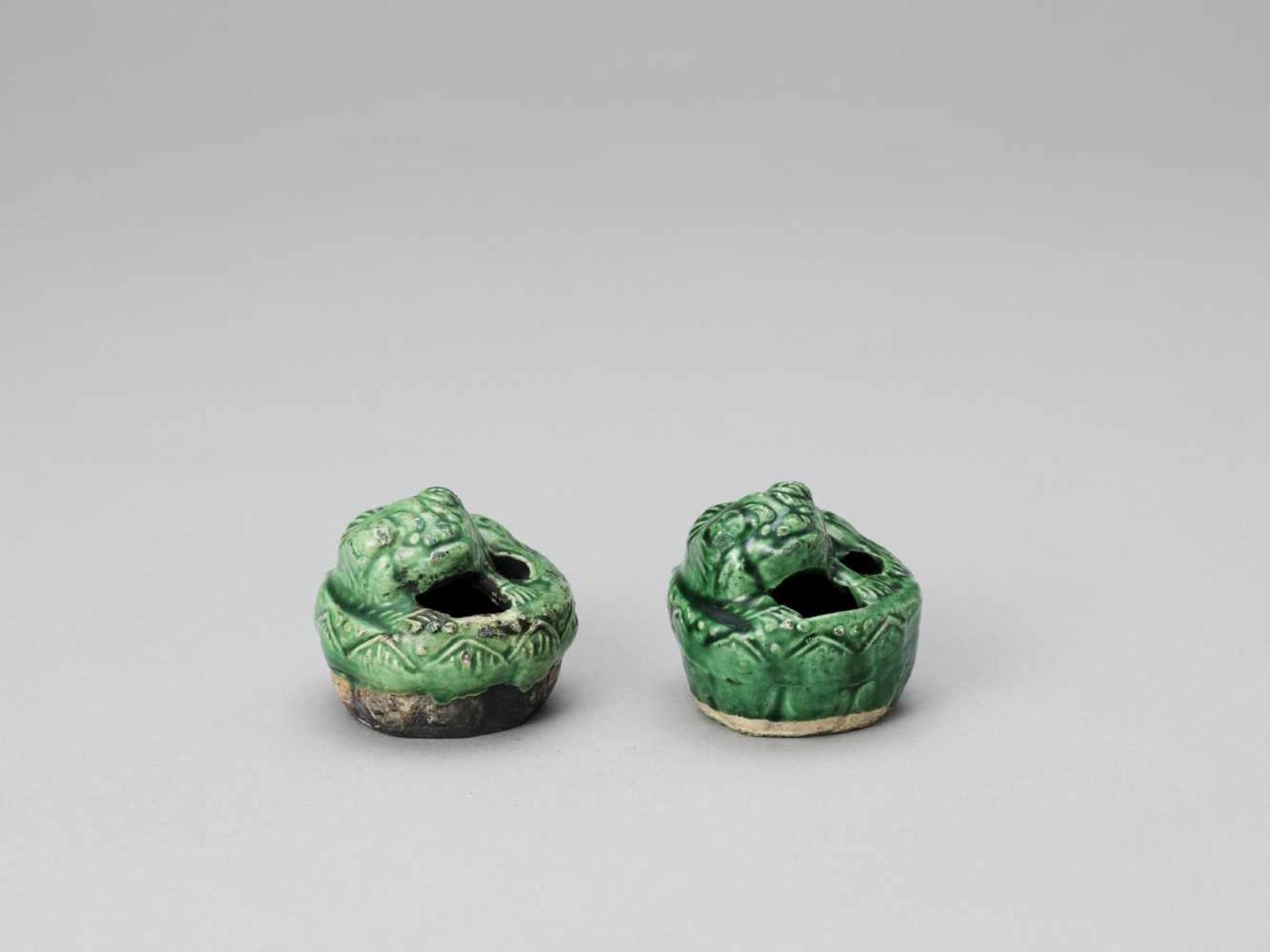 A PAIR OF EMERALD GREEN GLAZED POTTERY BUDDHIST LION WATER DROPPERS, KANGXI