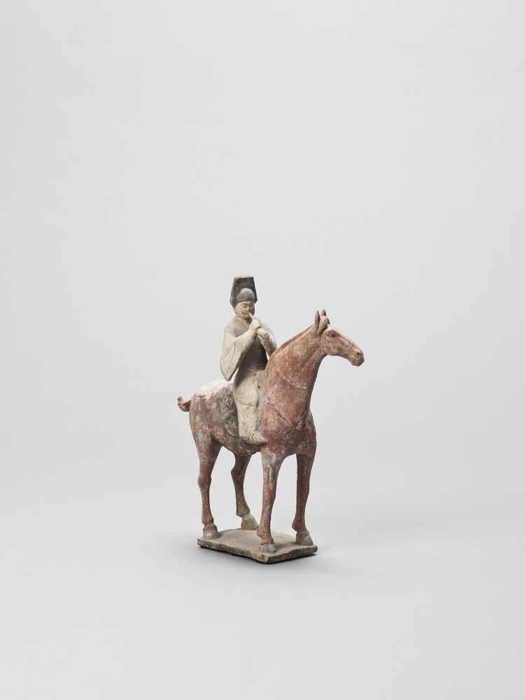 A COLD-PAINTED TERRACOTTA MODEL OF A HORSE AND RIDER, TANG