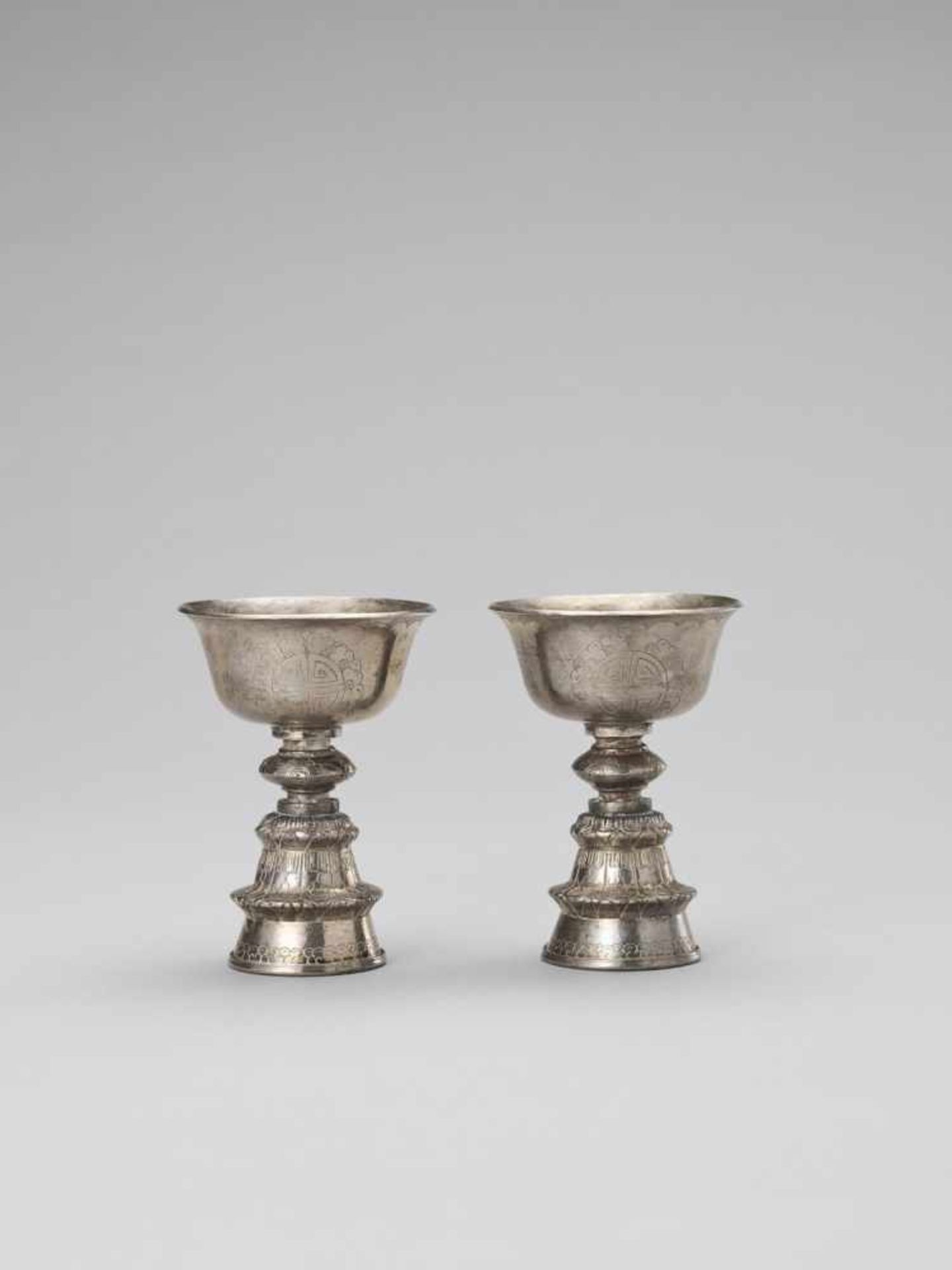 A PAIR OF SINO-TIBETAN BUTTER LAMPS, LATE 19TH CENTURY