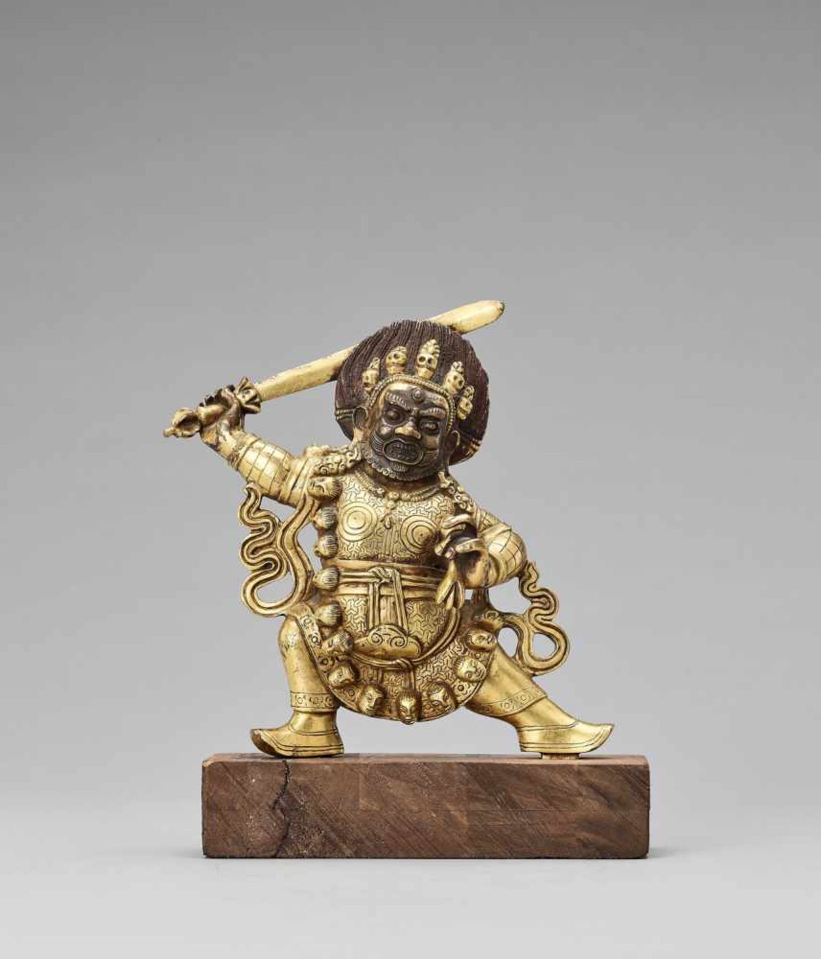 A TIBETAN FIRE-GILT BRONZE FIGURE OF BEGTSE