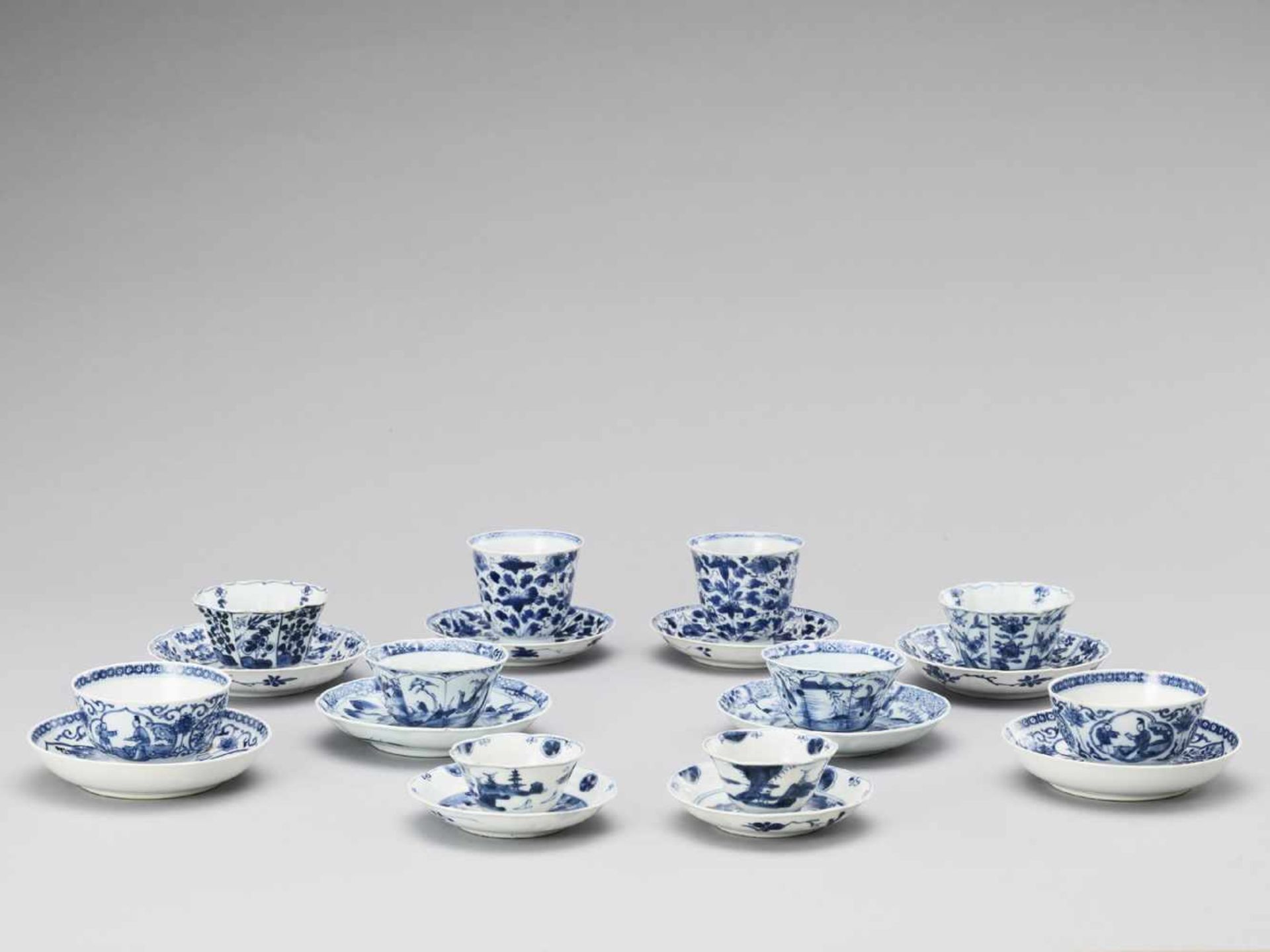 FIVE PAIRS OF BLUE AND WHITE CUPS WITH MATCHING PLATES