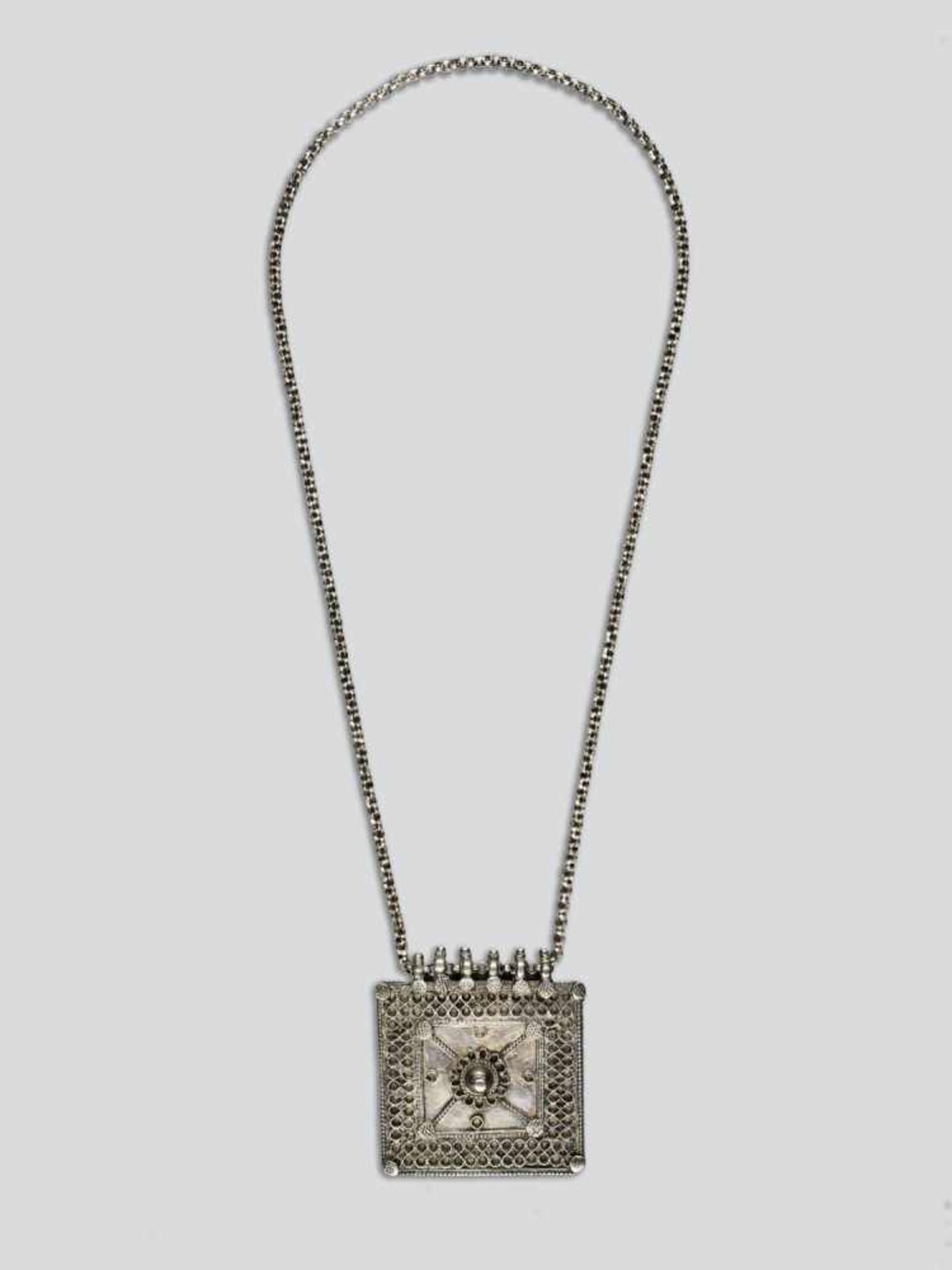 A GAU BOX SILVER PENDANT, 19th CENTURY