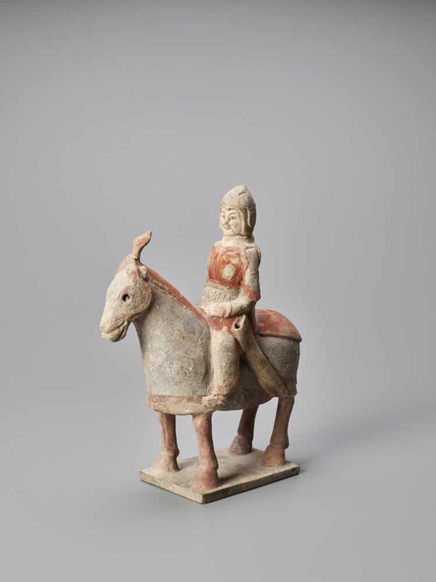 A TERRACOTTA FIGURE OF A HORSE AND RIDER, NORTHERN WEI