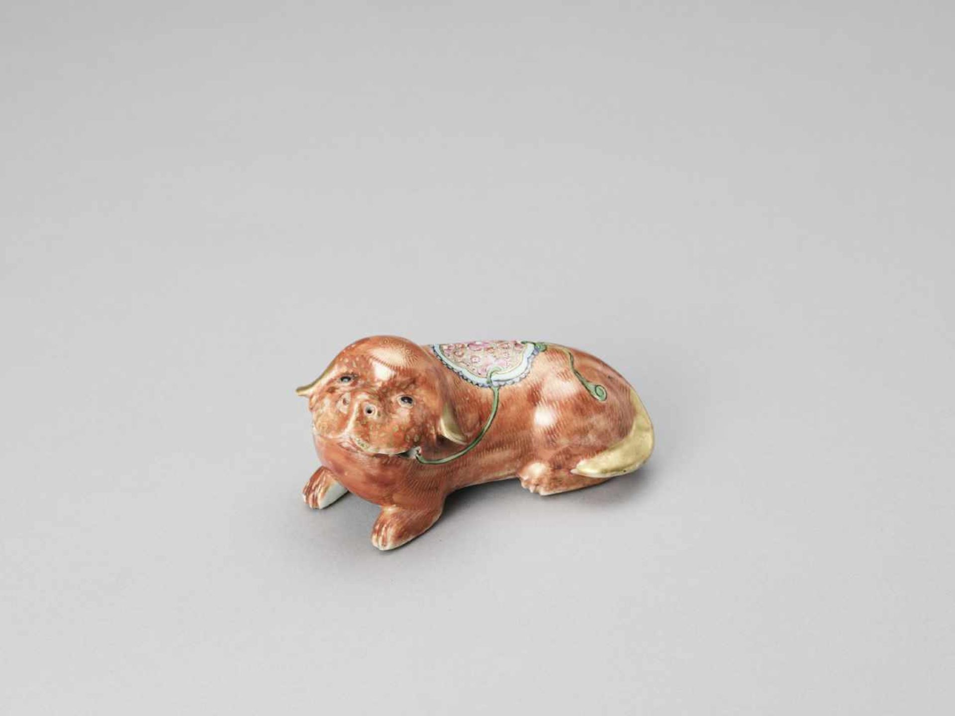 A FAMILLE ROSE PORCELAIN DOG, QING