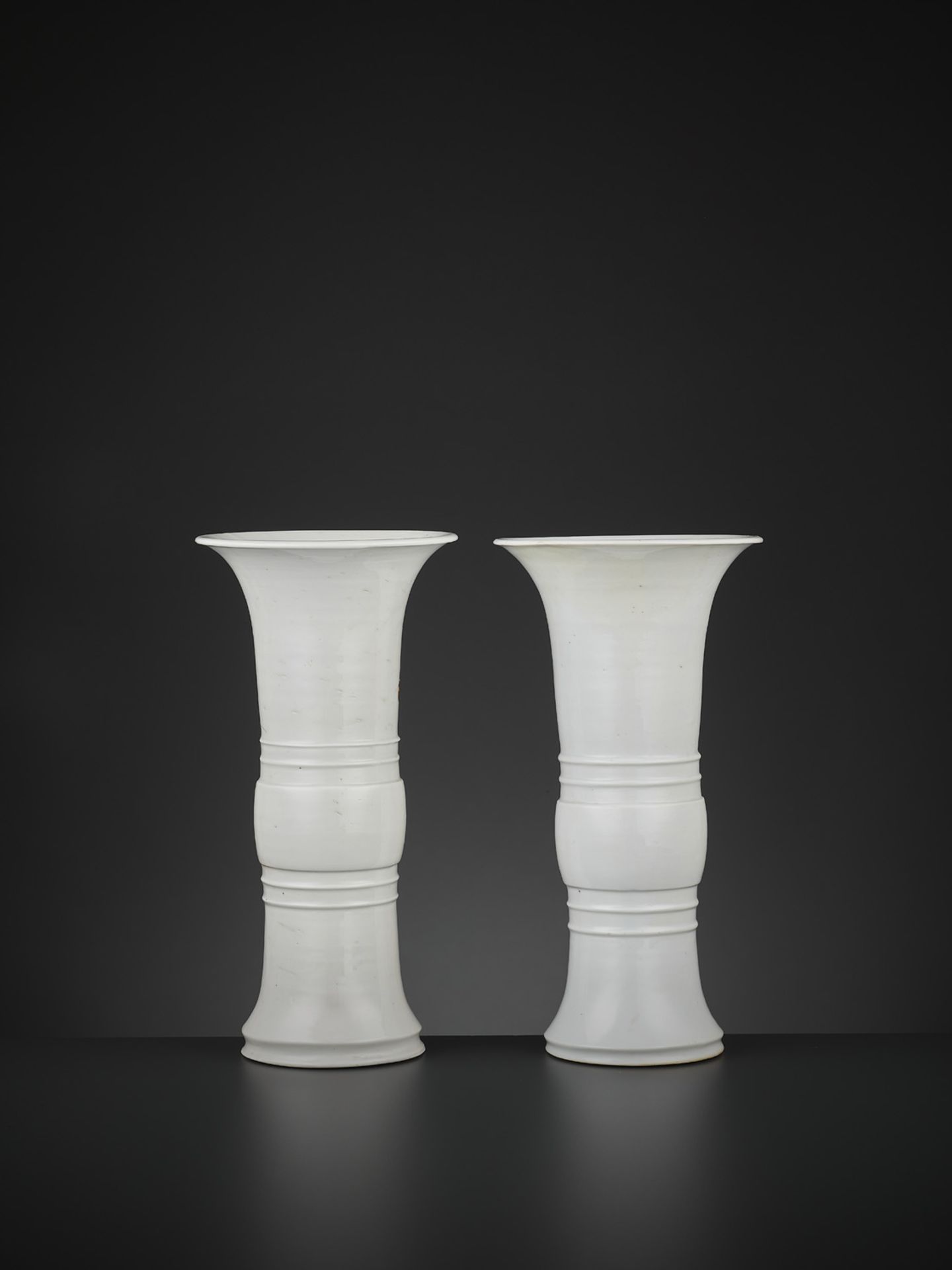 A PAIR OF DEHUA BEAKER VASES, GU