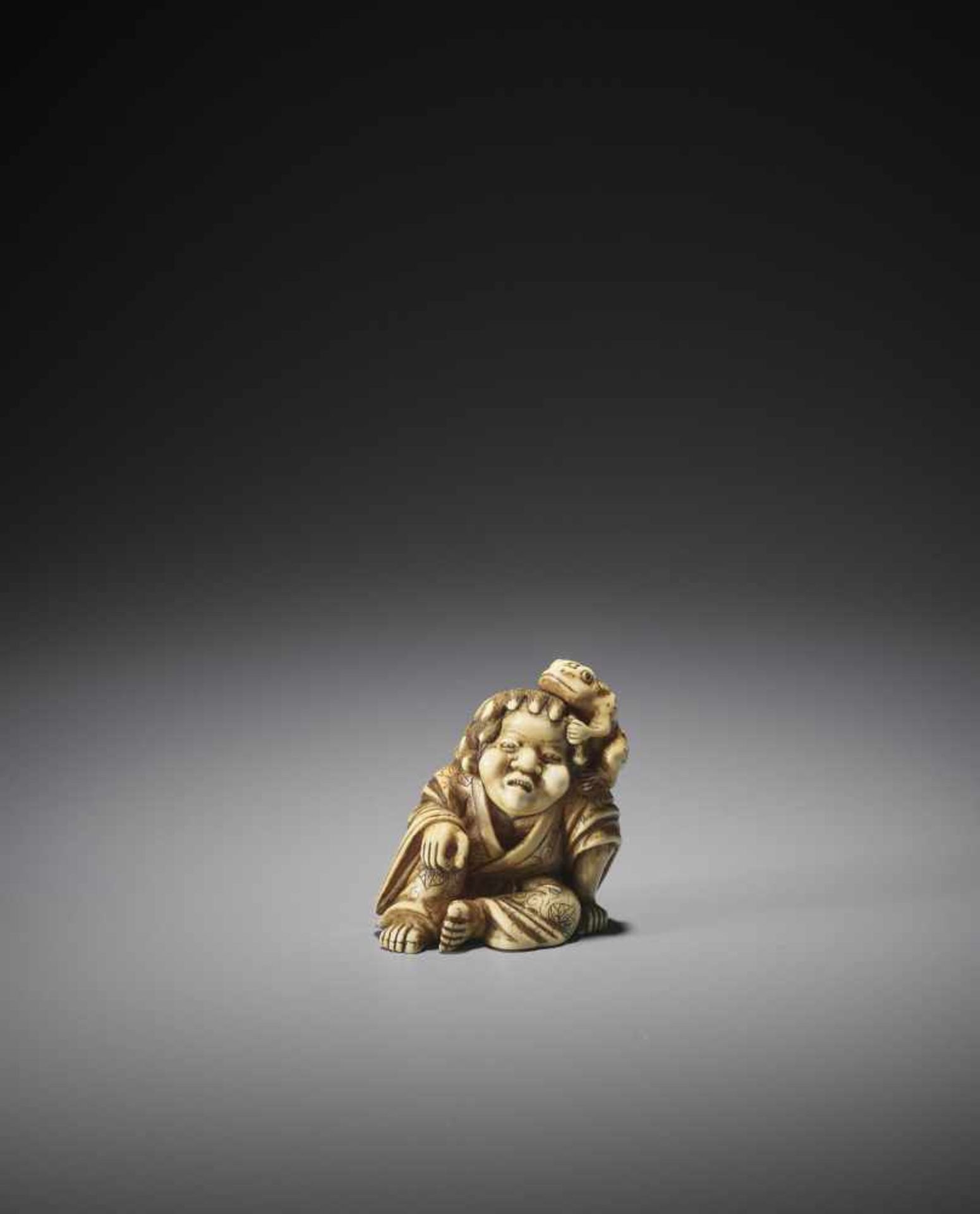 A LARGE AND POWERFUL IVORY NETSUKE OF GAMA SENNIN