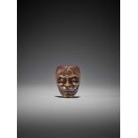 RYUZAN: A BOXWOOD MASK NETSUKE OF A DEMON