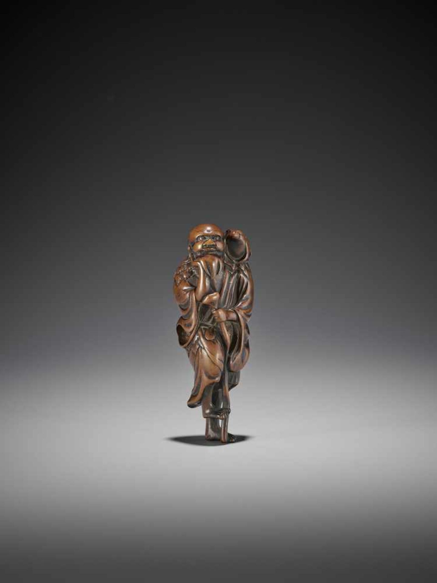 A WOOD NETSUKE OF GAMA SENNIN