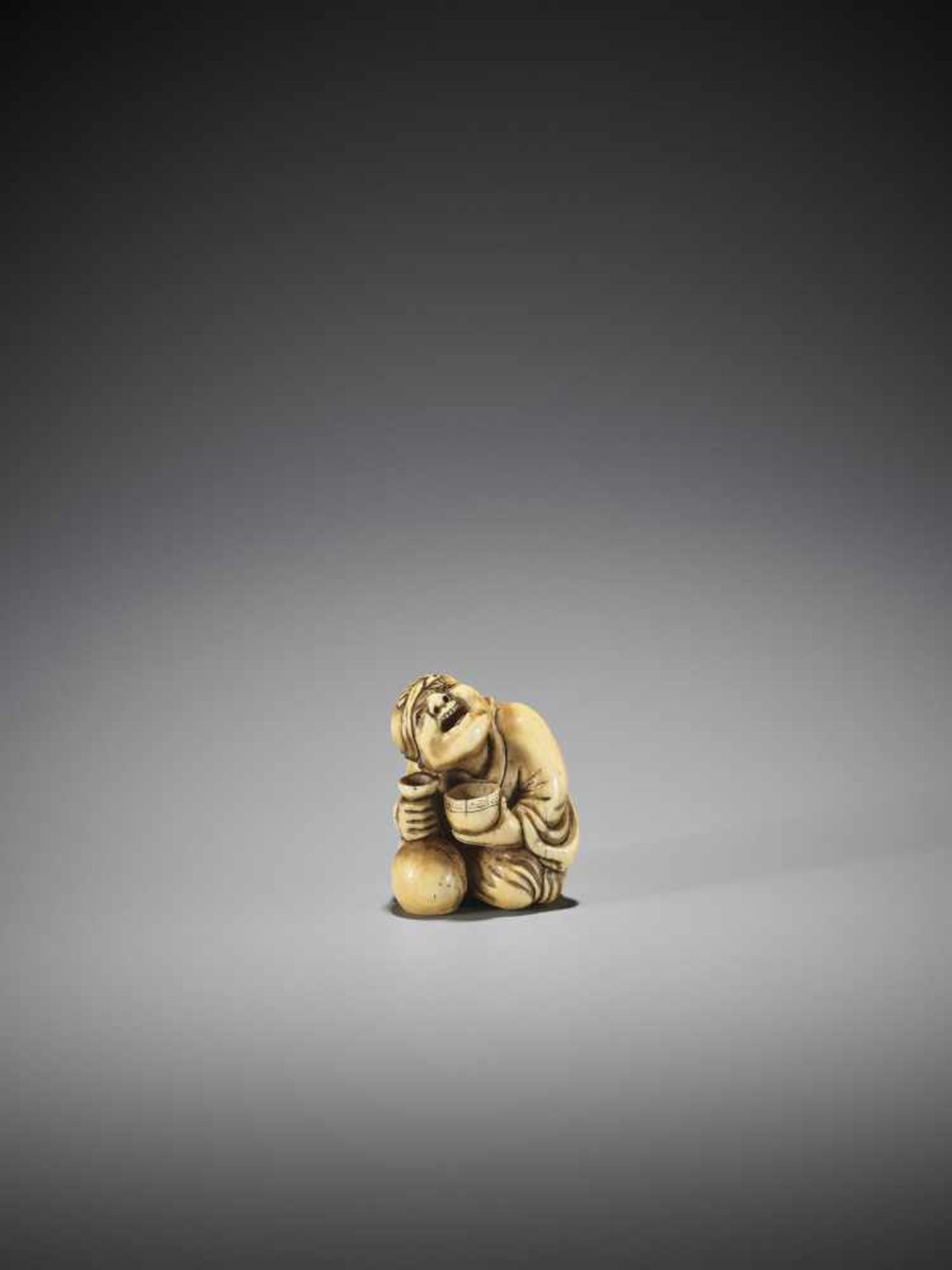 YOSHIMASA: A RARE IVORY NETSUKE OF A DRUNKARD - Image 2 of 8