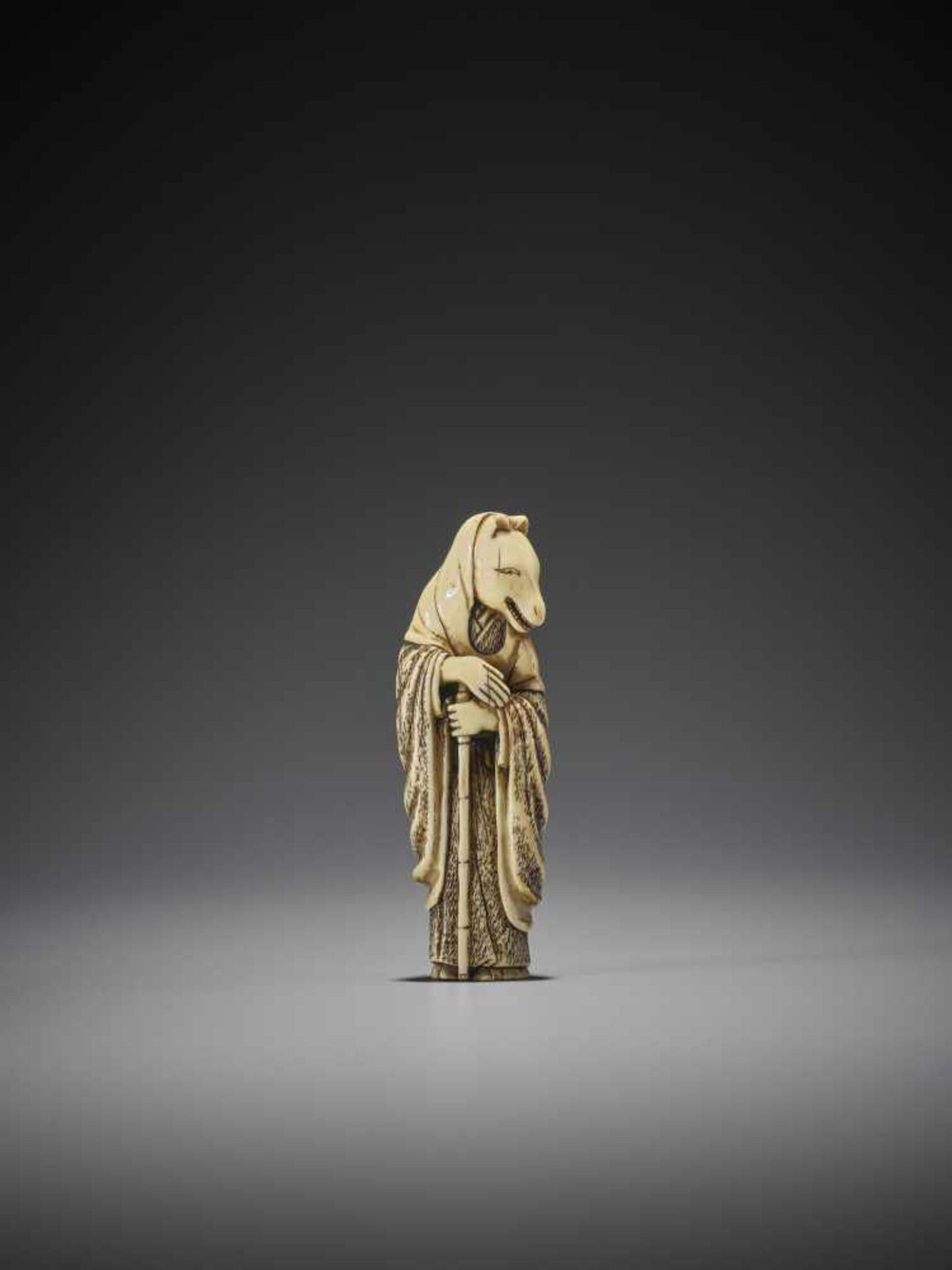 AN IVORY NETSUKE OF THE FOX PRIEST HAKUSOZU