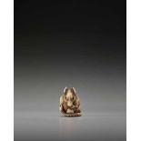 A POWERFUL KYOTO SCHOOL IVORY NETSUKE OF A RAT WITH A BEAN POD