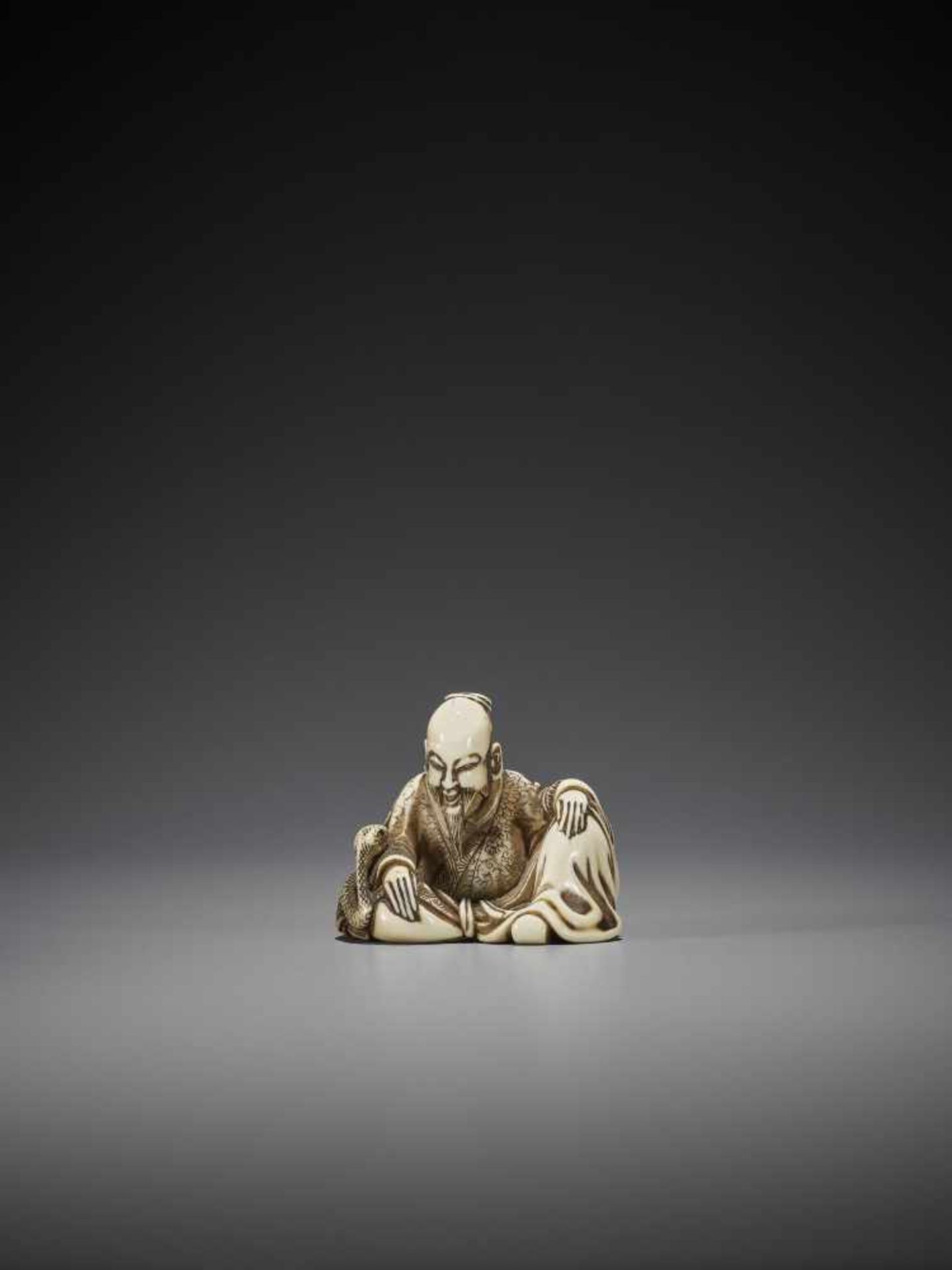 HOSHIN: A RARE IVORY NETSUKE OF A CHINESE SAGE WITH SNAKE