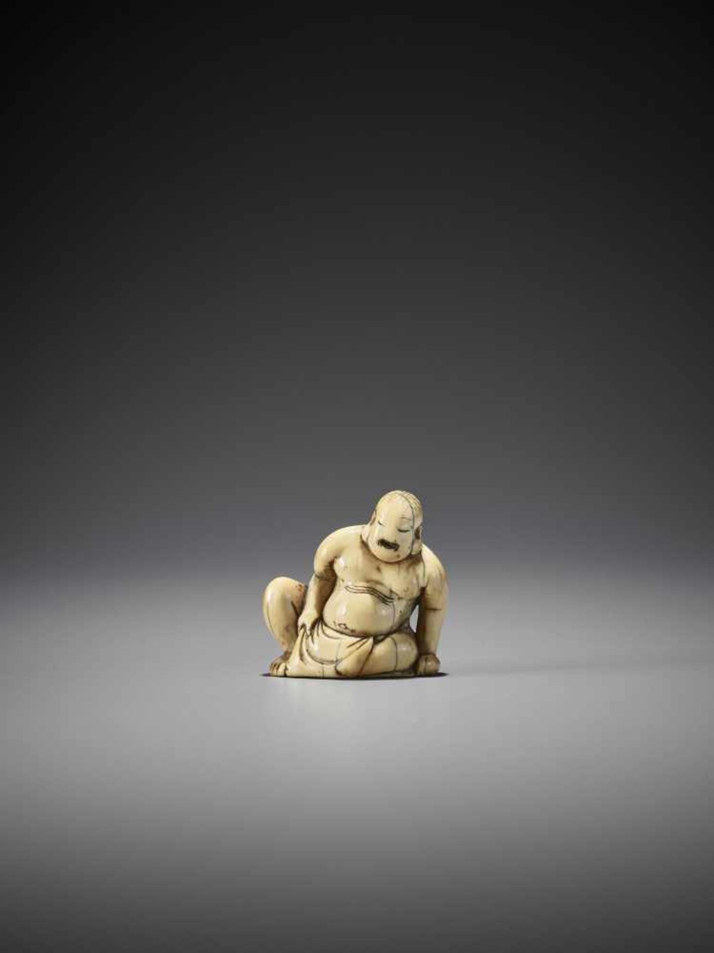 AN EARLY IVORY NETSUKE OF HOTEI