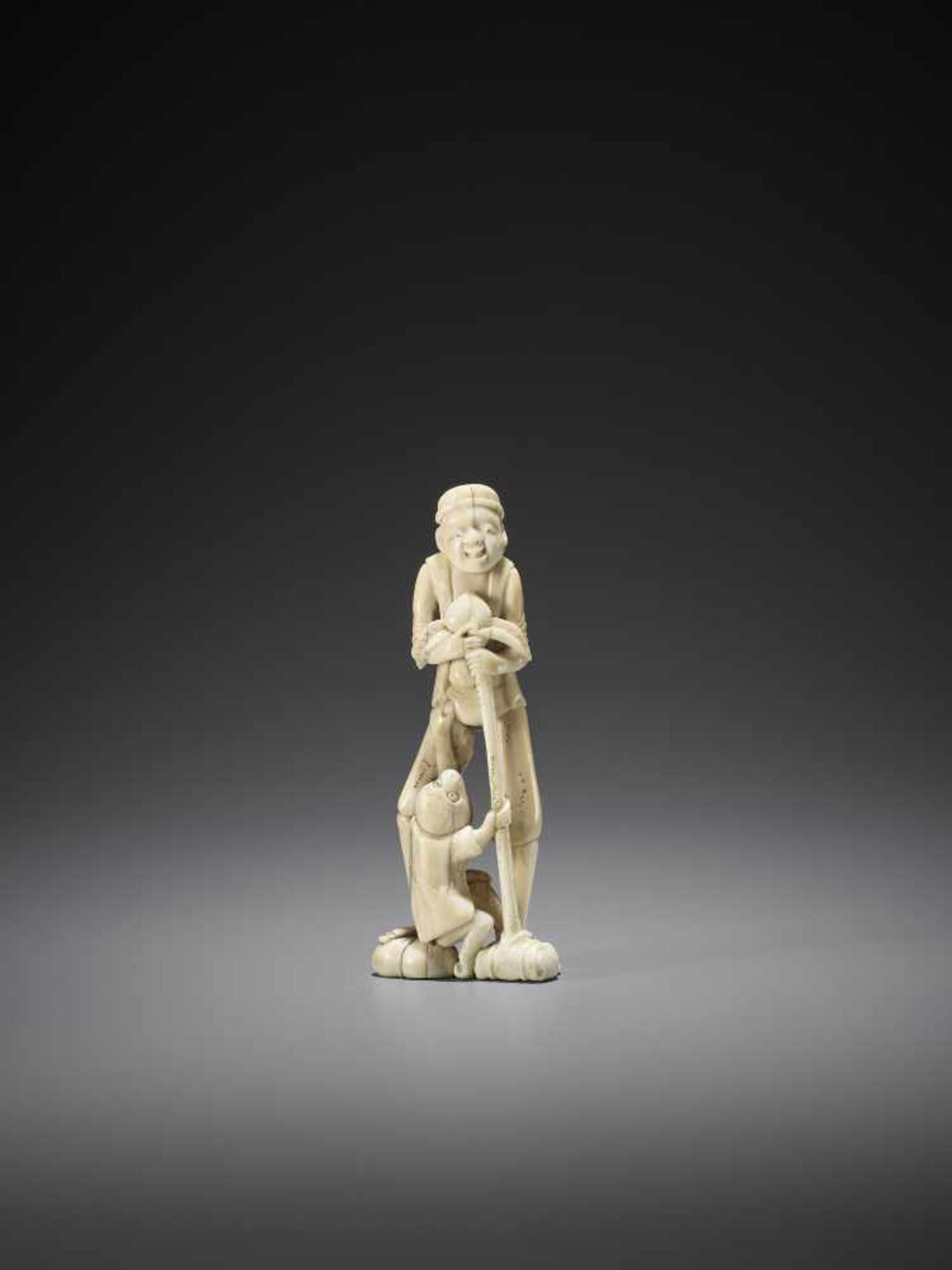 A TALL WALRUS IVORY NETSUKE OF A SARUMAWASHI - Image 2 of 8