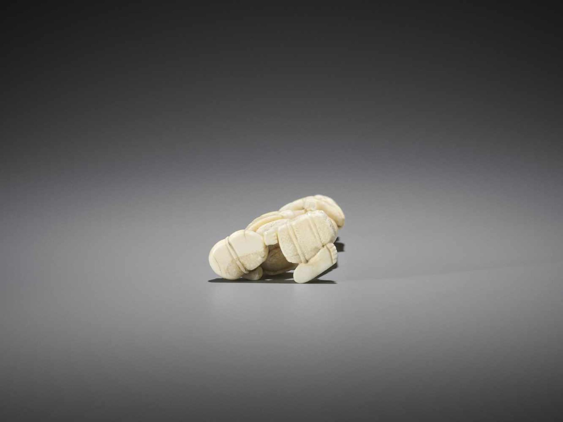 A TALL WALRUS IVORY NETSUKE OF A SARUMAWASHI - Image 8 of 8