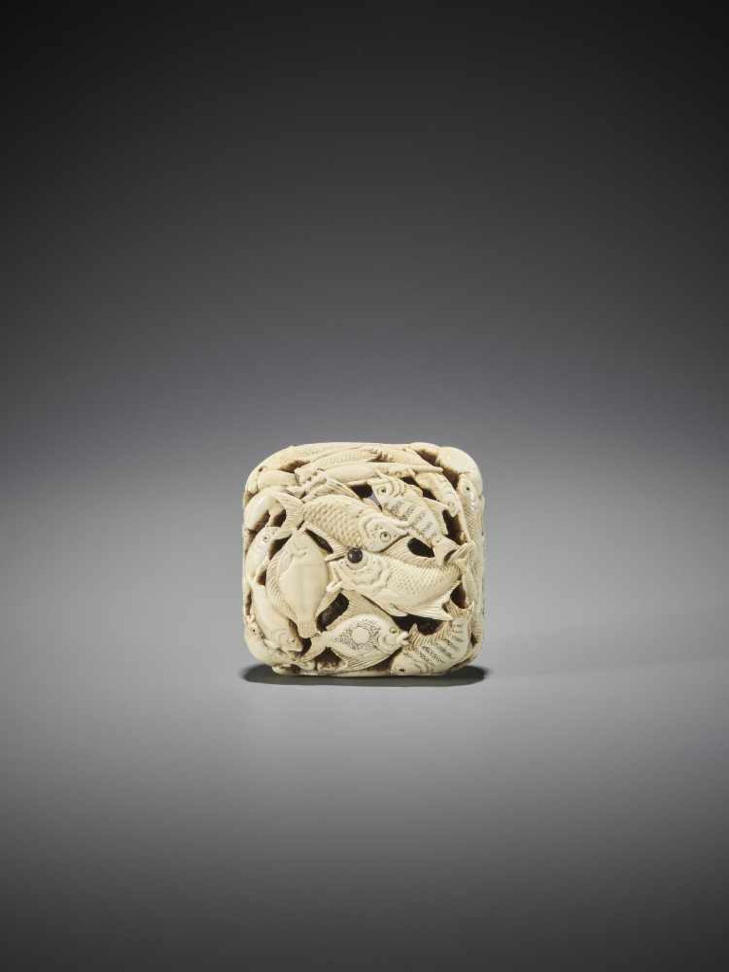 HOSAI MASAHIRO: A LARGE IVORY NETSUKE WITH MARINE LIFE