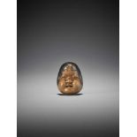 HIDARI ISSAN: A BOXWOOD MASK NETSUKE OF OTO