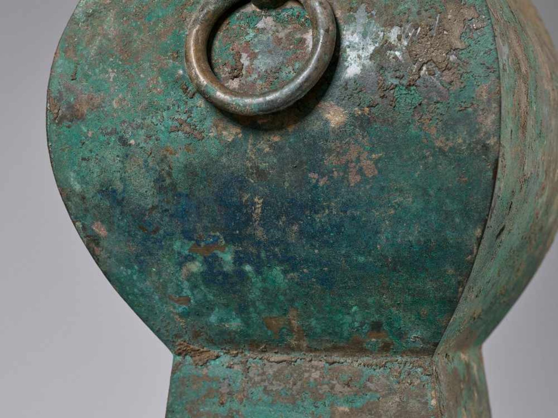 A FACETED BRONZE STORAGE VESSEL, FANGHU, HAN DYNASTY China, 206 BC-AD 220. The faceted pear-shaped - Image 2 of 20