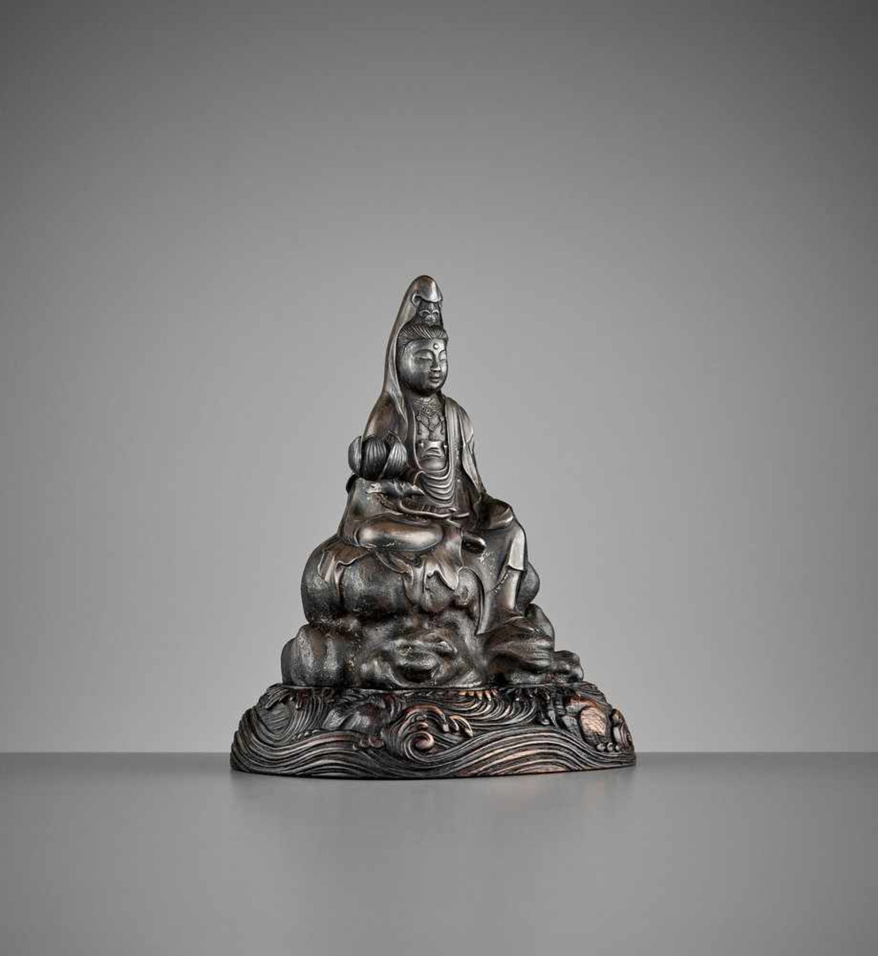 A SILVERED ‘ROYAL EASE’ BRONZE FIGURE OF GUANYIN, EARLY QING DYNASTY <br - Image 9 of 10