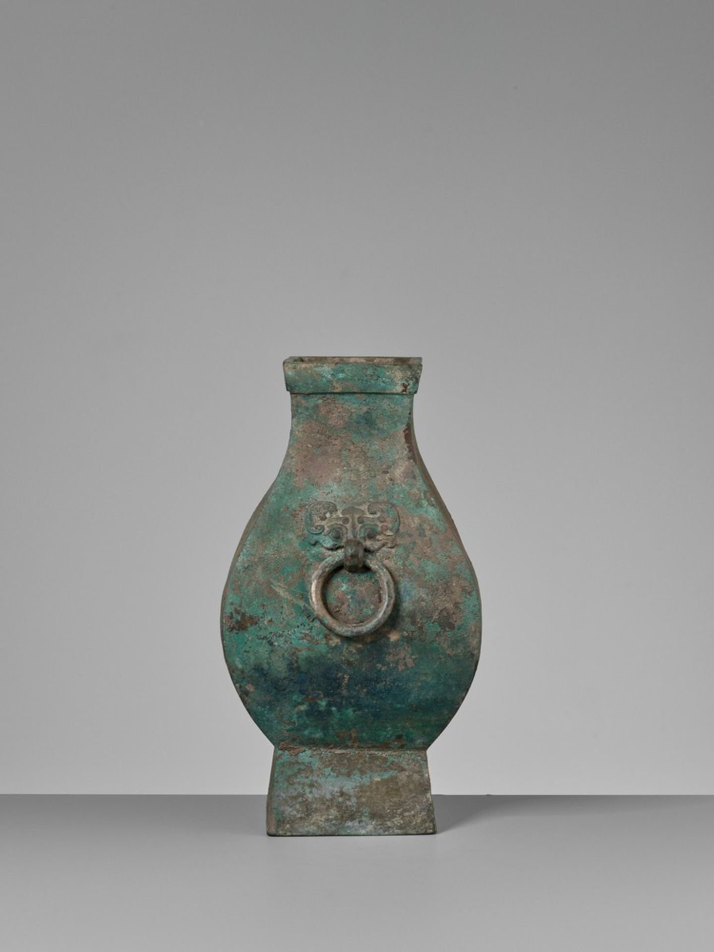 A FACETED BRONZE STORAGE VESSEL, FANGHU, HAN DYNASTY China, 206 BC-AD 220. The faceted pear-shaped - Image 10 of 20