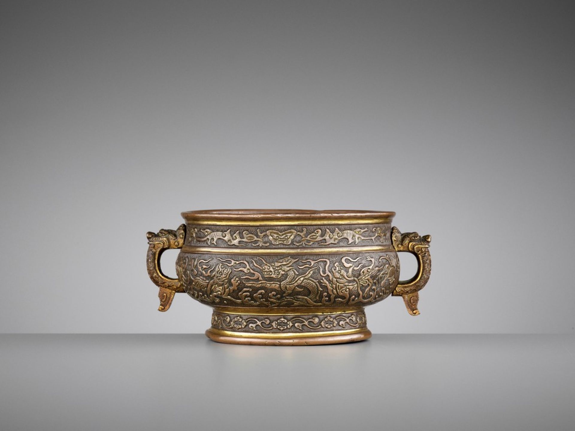 A HU WENMING PARCEL-GILT ‘DRAGON’ BRONZE CENSER, LATE MING <br