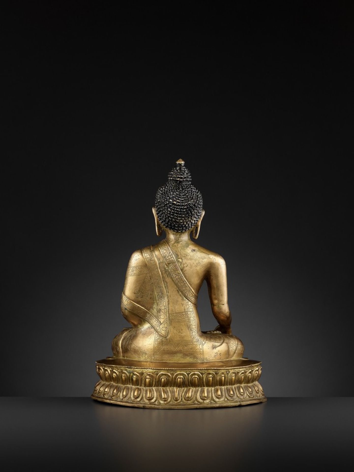 A GILT-BRONZE FIGURE OF BUDDHA SHAKYAMUNI, BEIJING OR INNER MONGOLIA, 17TH CENTURY - Image 6 of 11