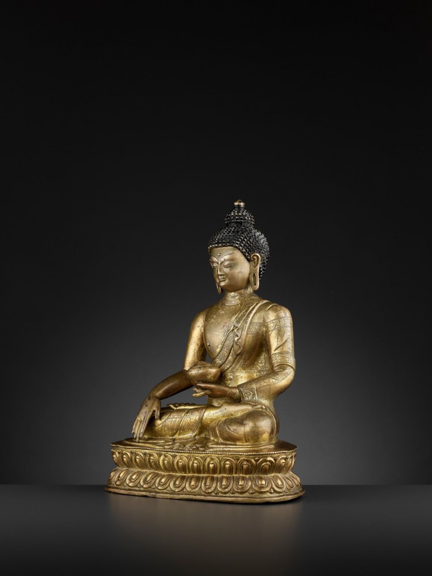 A GILT-BRONZE FIGURE OF BUDDHA SHAKYAMUNI, BEIJING OR INNER MONGOLIA, 17TH CENTURY - Image 4 of 11