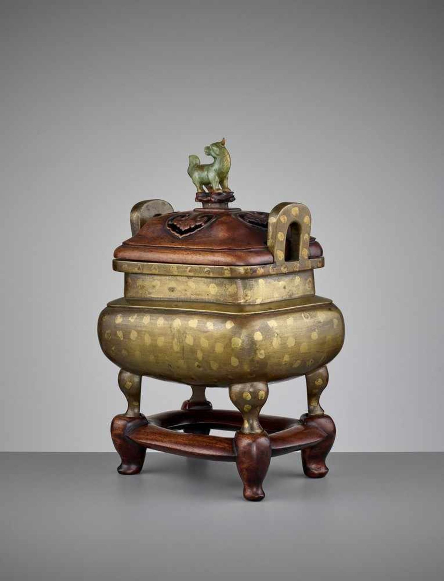 A GOLD-SPLASHED BRONZE CENSER WITH HARDWOOD COVER AND BASE, 17TH CENTURY