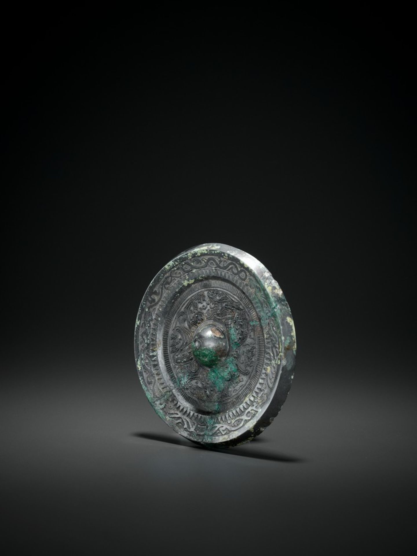 A SILVERY BRONZE CIRCULAR MIRROR, HAN DYNASTY - Image 2 of 4