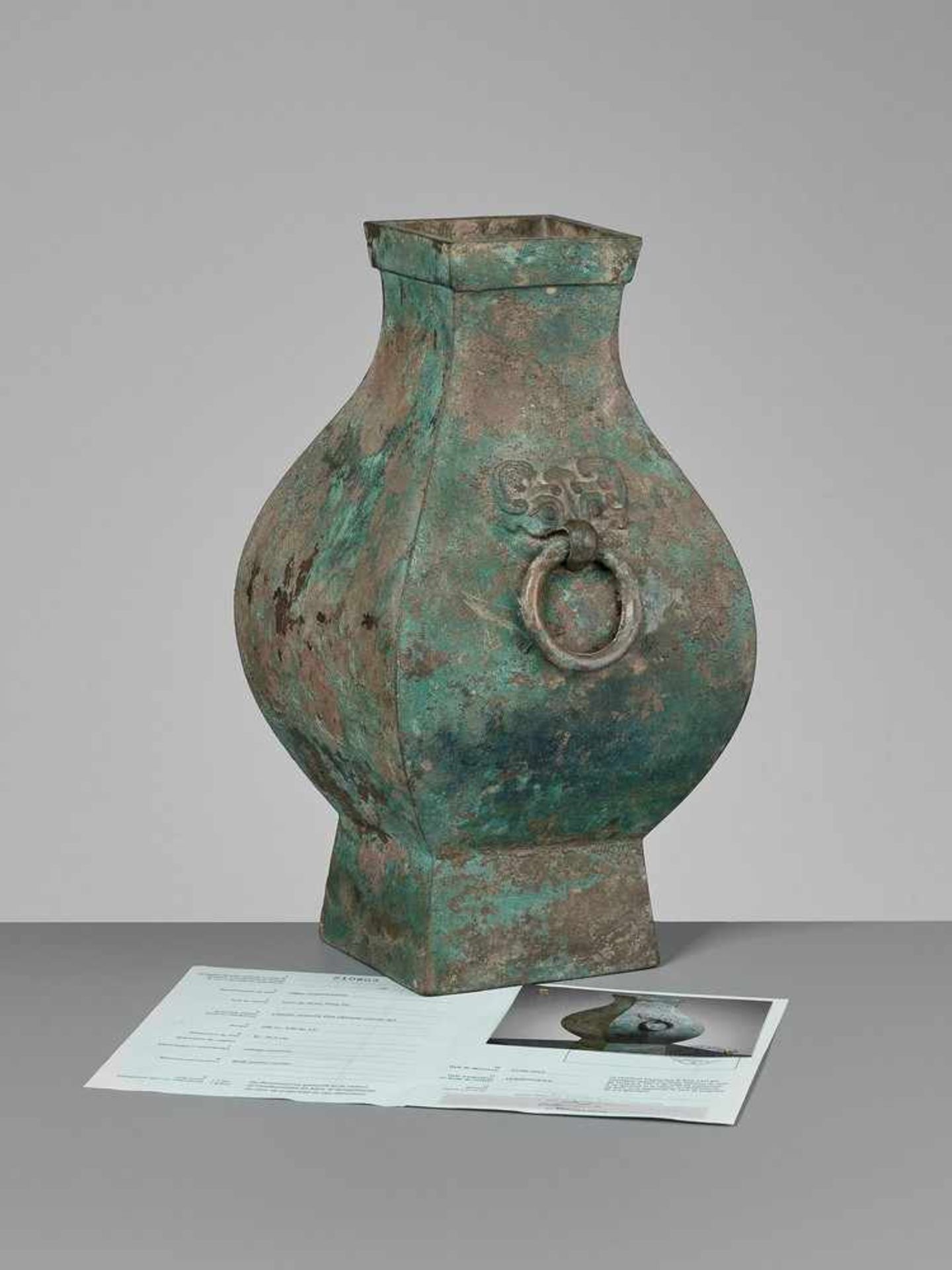 A FACETED BRONZE STORAGE VESSEL, FANGHU, HAN DYNASTY China, 206 BC-AD 220. The faceted pear-shaped - Image 3 of 20