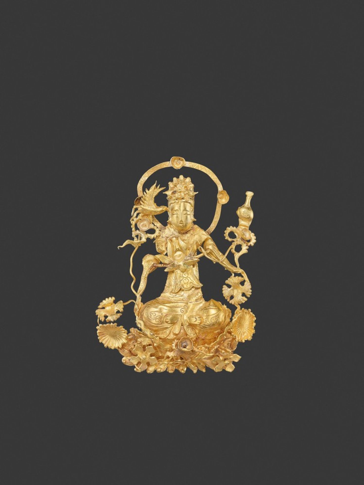 A LIAO DYNASTY GOLD REPOUSSÉ 'GUANYIN' FILIGREE ORNAMENT China, 916-1125. The Goddess of Mercy