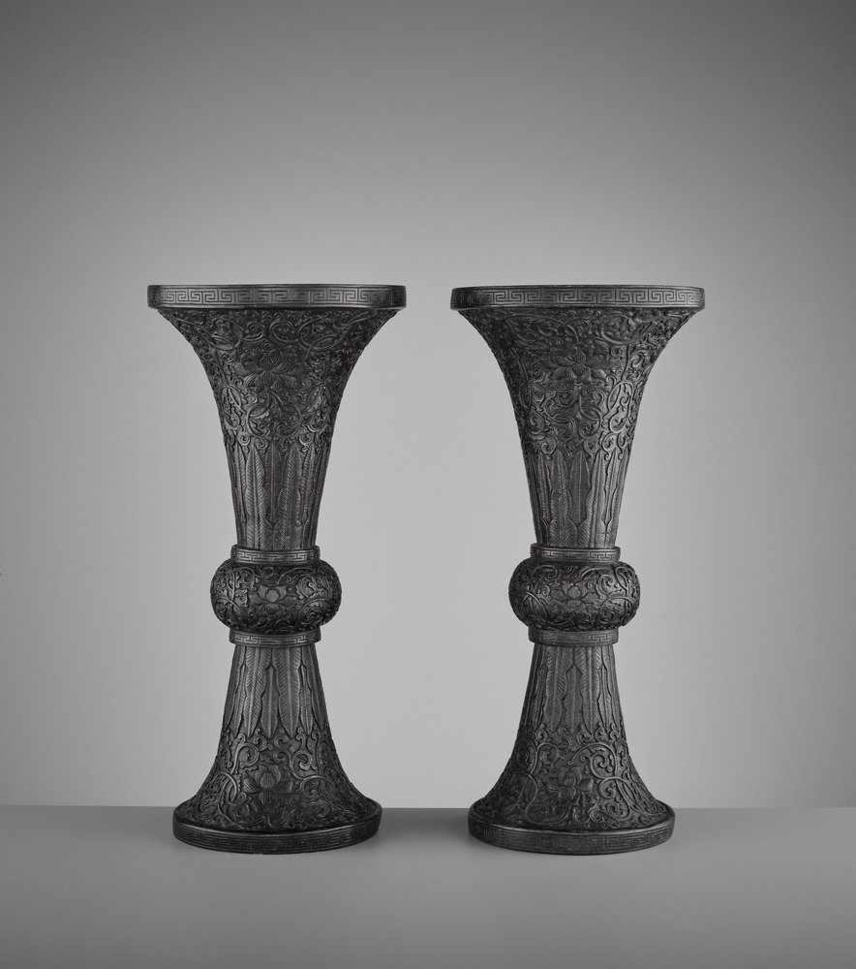 A PAIR OF BRONZE REPOUSSÉ GU VASES, MID-QING <