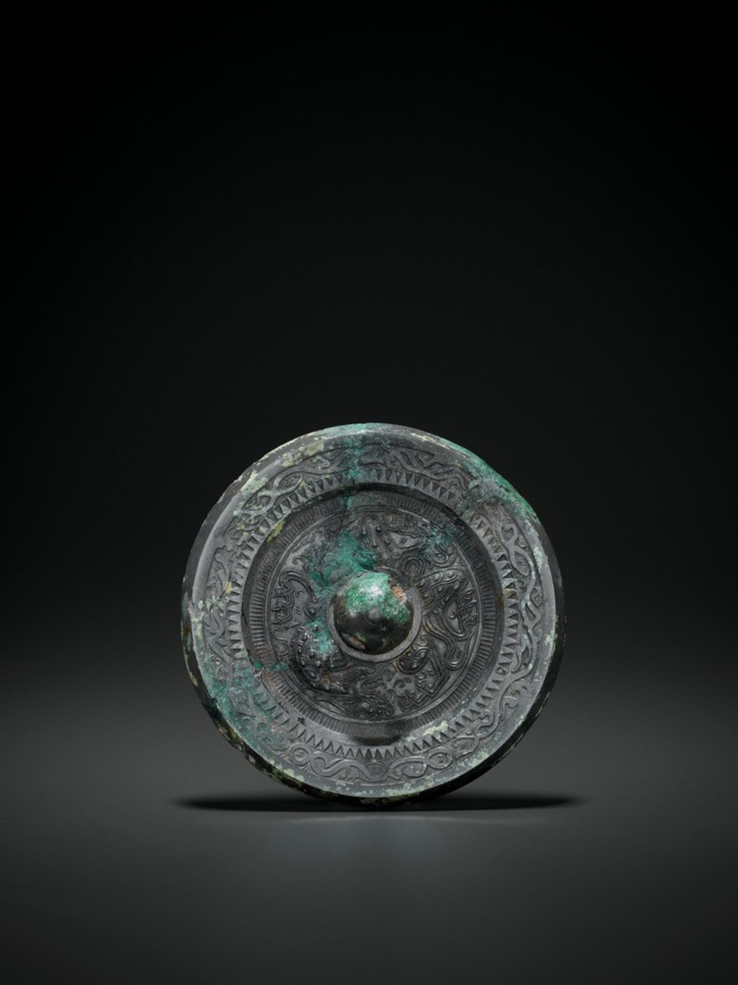 A SILVERY BRONZE CIRCULAR MIRROR, HAN DYNASTY