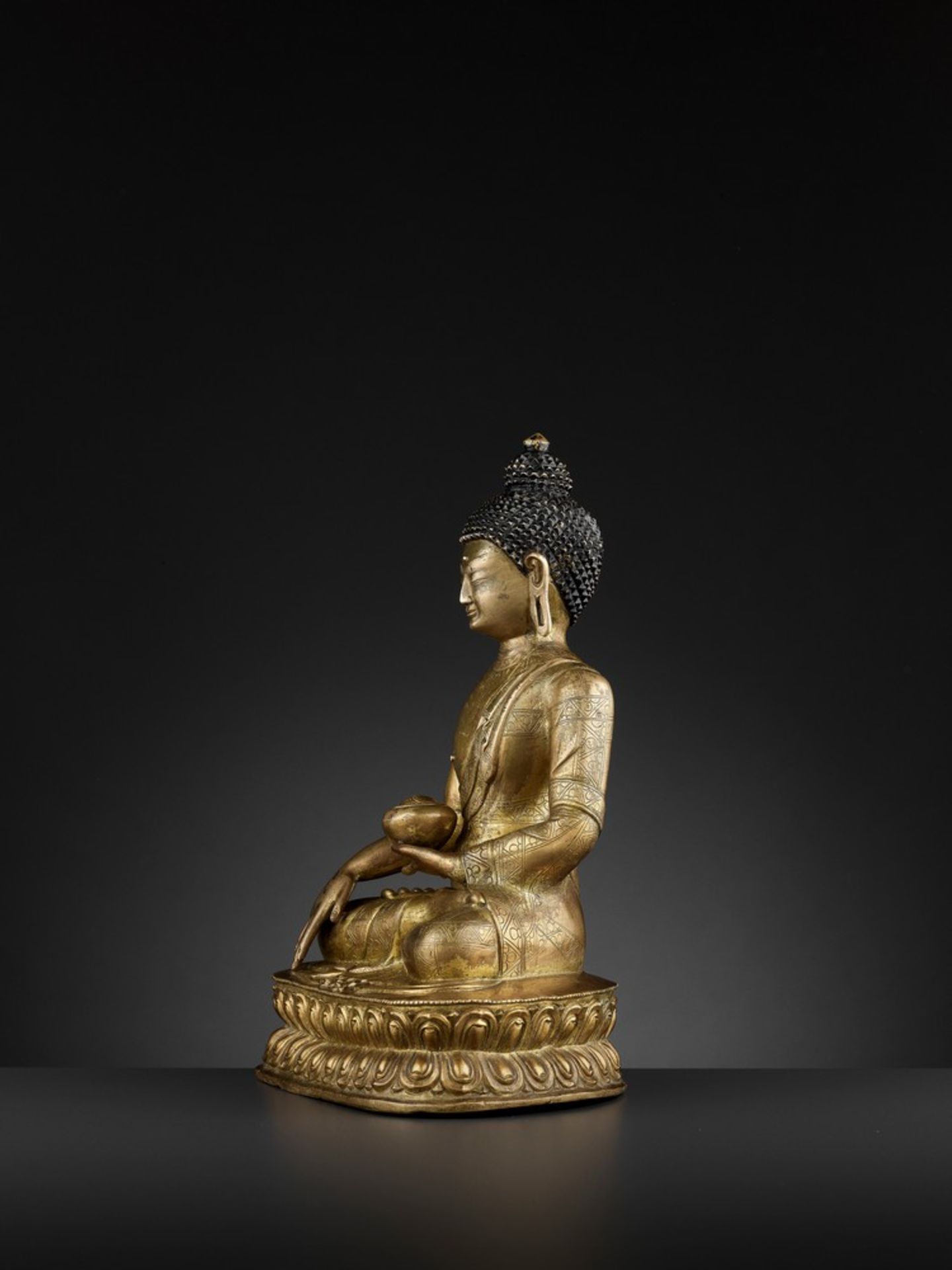 A GILT-BRONZE FIGURE OF BUDDHA SHAKYAMUNI, BEIJING OR INNER MONGOLIA, 17TH CENTURY - Image 5 of 11