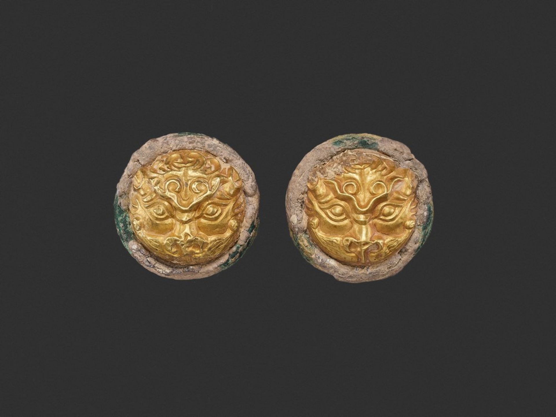 A PAIR OF GOLD REPOUSSÉ 'MYTHICAL BEAST' HORSETACK ORNAMENTS, LATE WARRING STATES TO HAN <